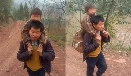 Cha cõng con 30 km đến trường mỗi ngày