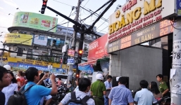 Công an trả lại 14.000 USD tạm giữ của tiệm vàng Hoàng Mai