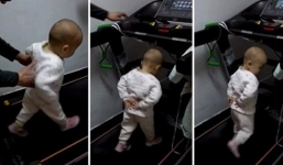 Bé...17 tháng tuổi bị bố mẹ thúc giục trên máy chạy bộ