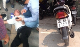 Đang đi xe máy, ông cụ đột nhiên lăn đùng ra ngất