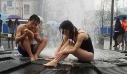 Đôi nam nữ thản nhiên tắm giữa đường phố Trung Quốc