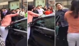 Clip: Vợ đập nát kính xe ô tô, tay be bét máu vì nghi chồng ngoại tình