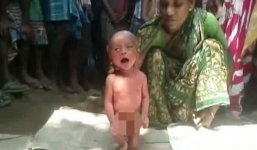 Video: 'Lang băm' túm cổ bắt bé 2 ngày tuổi tập đi để chữa sốt