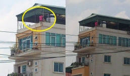 Hà Nội: Thót tim, cô gái trèo ra lan can tầng 6