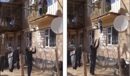 Lười đi cầu thang, bà mẹ thả con từ ban công xuống đất