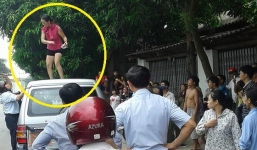 Người phụ nữ nhảy lên nóc xe chở lãnh đạo huyện nhảy múa