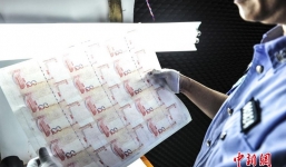 Trăm cảnh sát phá đường dây làm tiền giả chấn động Trung Quốc