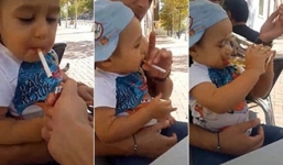 Video: Bố cho con trai 1 tuổi hút thuốc lá, uống bia gây sốc