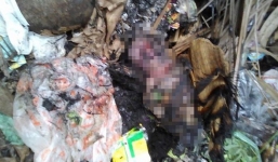 Thấy con đã tử vong, mẹ mang ra bãi rác đốt