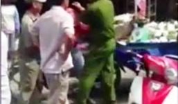 Cảnh sát quật ngã người bán hàng rong trần tình