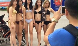 Người mẫu mặc bikini dắt xe máy cho khách được báo Thái Lan đăng tải