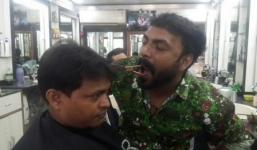 Cận cảnh người thợ cắt tóc điêu luyện bằng miệng