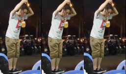 Nữ ảo thuật đường phố dùng ống hút giữ cốc bia lơ lửng