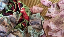 Tá hỏa phát hiện hơn 30 triệu đồng biến dạng vì dùng máy sấy khô