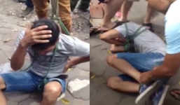 Đám đông trói tay chân, đánh hội đồng thanh niên trộm xe máy