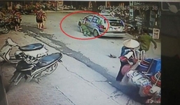 Tài xế taxi đóng cửa xe kẹp tay cảnh sát rồi kéo lê trên đường