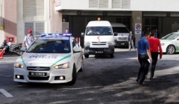 Cảnh sát vũ trang hộ tống thi thể ông Kim Jong-nam