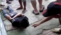 Nghi phạm ấu dâm bị trói vào biển chỉ đường