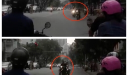 Thanh niên đầu trần đánh võng trước đoàn xe đưa đón Thủ tướng