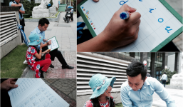 Anh nhân viên ngân hàng dành giờ nghỉ trưa mỗi ngày để dạy chữ cho cô bé vé số ngay trên vỉa hè Sài Gòn