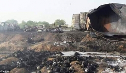 Bất chấp nguy hiểm lao ra 'hôi' dầu từ chiếc xe chở dầu bị lật, ít nhất 123 người chết