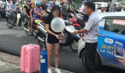 Clip sốc: Cô gái xinh đẹp quỵt tiền taxi, kéo theo bình khí, hít bóng cười rồi vạ vật giữa đường phố Hà Nội