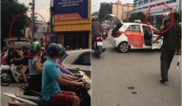 Tài xế taxi leo lên nóc ô tô 'ăn vạ' khi bị CSGT dừng xe nhắc nhở