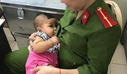Xúc động hình ảnh bé trai bị bỏ rơi được nữ công an phường cho bú sữa