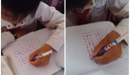 Cậu bé viết ngược mọi hướng bằng tay trái, chữ vẫn đẹp như thường
