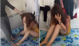 Clip xôn xao: Mặc cô nhân tình van xin, người vợ vẫn túm tóc cầm móc quần áo quật liên tiếp vào người