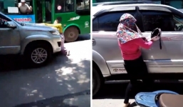 Phát hiện chồng chở bồ nhí trong xe ô tô, vợ liều mình đu lên nắp capo đánh ghen giữa đường