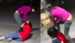 Thấy vợ lao vào túm tóc, đập đầu nhân tình xuống đường, người chồng can ngăn không được liền phóng ô tô bỏ đi