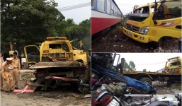 Gác chắn bị hỏng, tàu hỏa đâm hàng loạt ôtô, xe máy