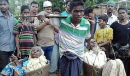 Thực hư bức ảnh người đàn ông gánh cha mẹ chạy trốn hơn 160km nhận 22 nghìn like gây bão MXH