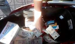 Cắt ghép 2 nửa tờ 500.000 và 20.000 ngang nhiên mang ra ngân hàng giao dịch