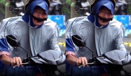 Nghẹn ngào cảnh người đàn ông chạy xe máy gồng mình giữ cả người lẫn xe trước gió bão Noru