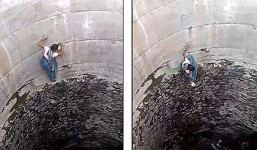 Thót tim cảnh phụ nữ Ấn Độ đu người dưới vách giếng dựng đứng để lấy nước 