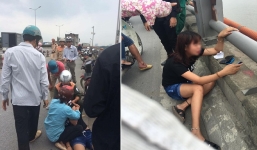 Cô gái ngất lịm khi bạn trai nhảy xuống sông Hồng tự tử sau màn cãi nhau