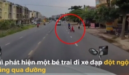 Tài xế container phanh cháy lốp, bẻ lái để cứu bé trai đột ngột qua đường