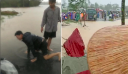 Chồng bất lực nhìn vợ bị lũ cuốn trôi khi đang trên đường đi sinh con