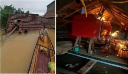 Xót xa cảnh quan tài mẹ già treo trên nóc nhà tránh lũ: 'Mẹ nằm đó 5 ngày rồi mà không có tiền thuê đò chở qua vùng khác'