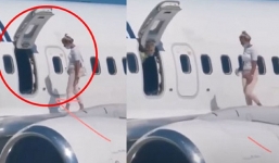 Ngồi máy bay ngột ngạt, nữ hành khách mở cửa thoát hiểm ra cánh đứng hóng gió