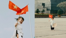 Em bé Việt Nam mặc áo dài trắng, cầm cờ đỏ sao vàng giữa tâm dịch: Cố lên Việt Nam ơi!