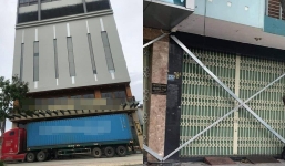 Bão số 9 phải ‘chịu thua’ khi người Việt nghĩ ra cách thuê container chắn giữa cửa ngăn gió và vật thể lạ