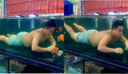 Trốn trông con, chồng nhảy vào bể cá chơi khiến cô vợ 'cạn lời'