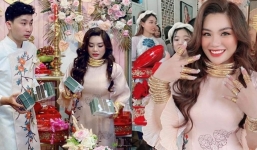 Cô dâu gây bão mạng xã hội với kiềng vàng nặng trĩu cổ, trên tay còn cầm thêm 4 cọc tiền mới cứng