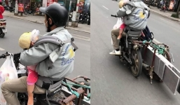 Ông bố một tay lái xe, tay còn lại ôm con: Tình phụ tử thiêng liêng hay mối nguy về tai nạn giao thông? 