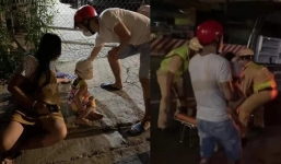 Vợ bầu hơn 7 tháng nằm vật bên đường không thể đi nổi, CSGT gọi điện báo thì chồng bận nhậu rồi tắt điện thoại