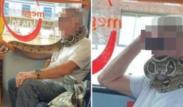 Sững sờ nhìn người đàn ông lấy rắn quấn quanh mặt làm khẩu trang ngừa Covid-19