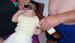 Phẫn nộ với hình ảnh người đàn ông đổ bia vào miệng đứa trẻ vài tháng tuổi